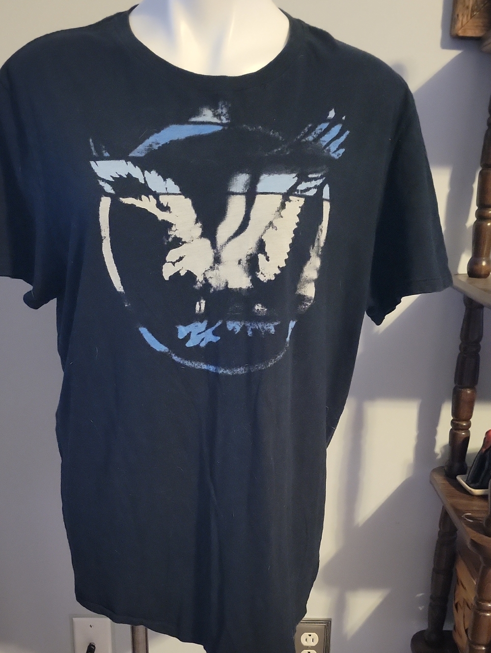 American Eagle Outfitters Black T-Shirt with White and Light Blue Eagle Graphic.